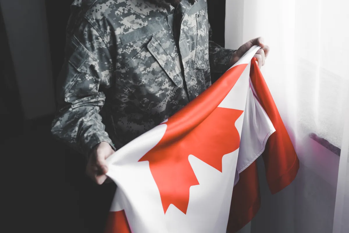 veteran holding Canadian flag